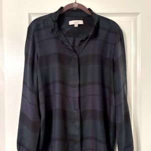 Long sleeve navy blue and green plaid shirt. Button front, ruffle collar/cuffs.